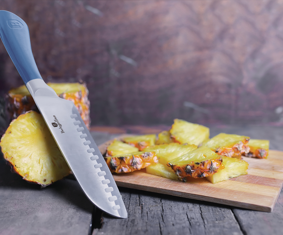 Fresh juicy pineapple on a background of Indian natural texture of wood sheet