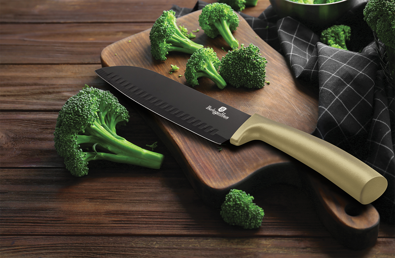 Fresh green broccoli and knife on wooden board