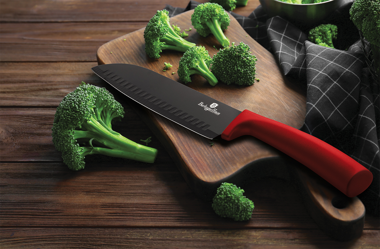 Fresh green broccoli and knife on wooden board