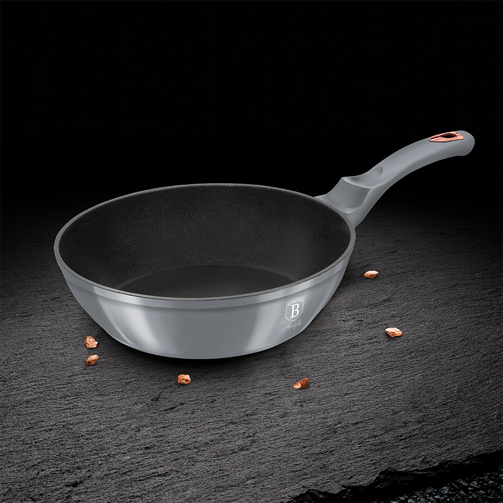 Partially Covered Copper Cooking Pot Between Garlic And Carving