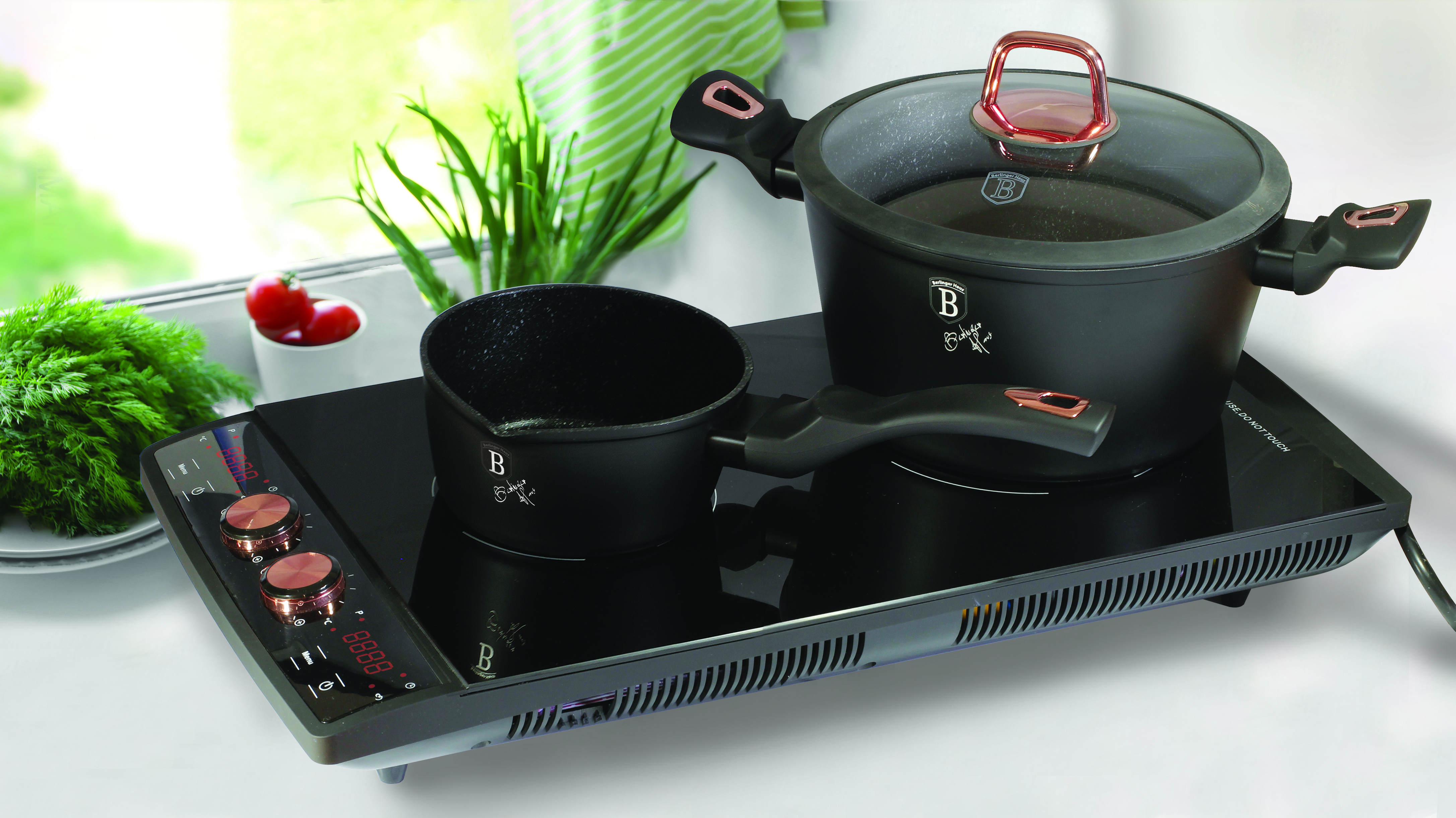 Metal pot with potato on induction cooker in kitchen