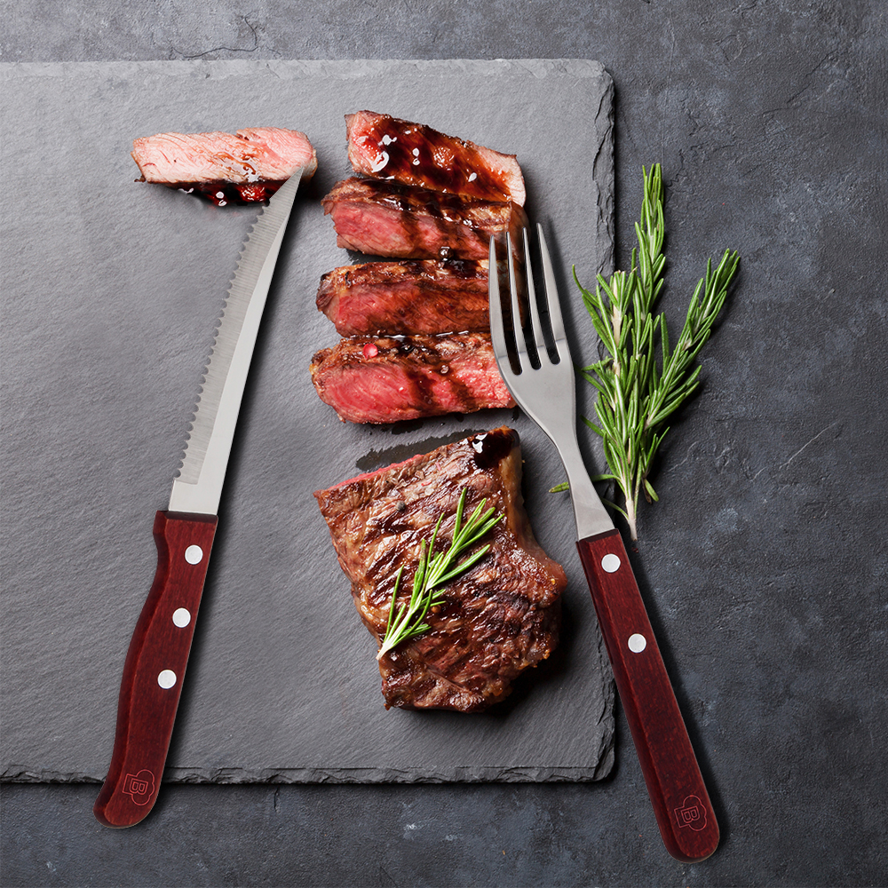 Grilled sliced beef steak with balsamico and rosemary on stone t